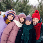 family in winter clothing staying warm to prevent winter illnesses