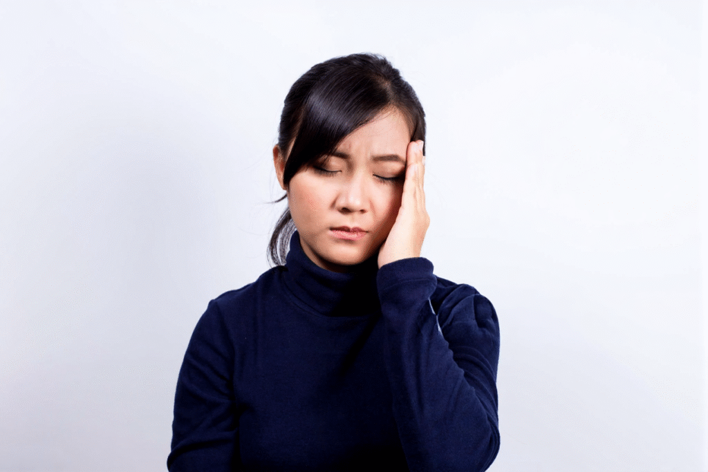 normal headache symptoms with mild tension pain in head