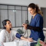 Doctor checking blood pressure of a young adult patient during a routine health checkup